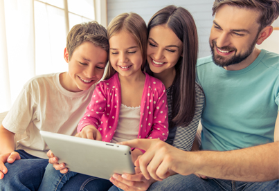 EMF-IMG2 Happy young family using devices protected by EMF Neutralizer